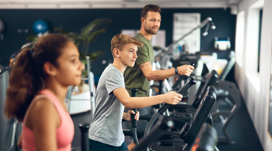 People training together on cardio equipment at LOOP Fitness